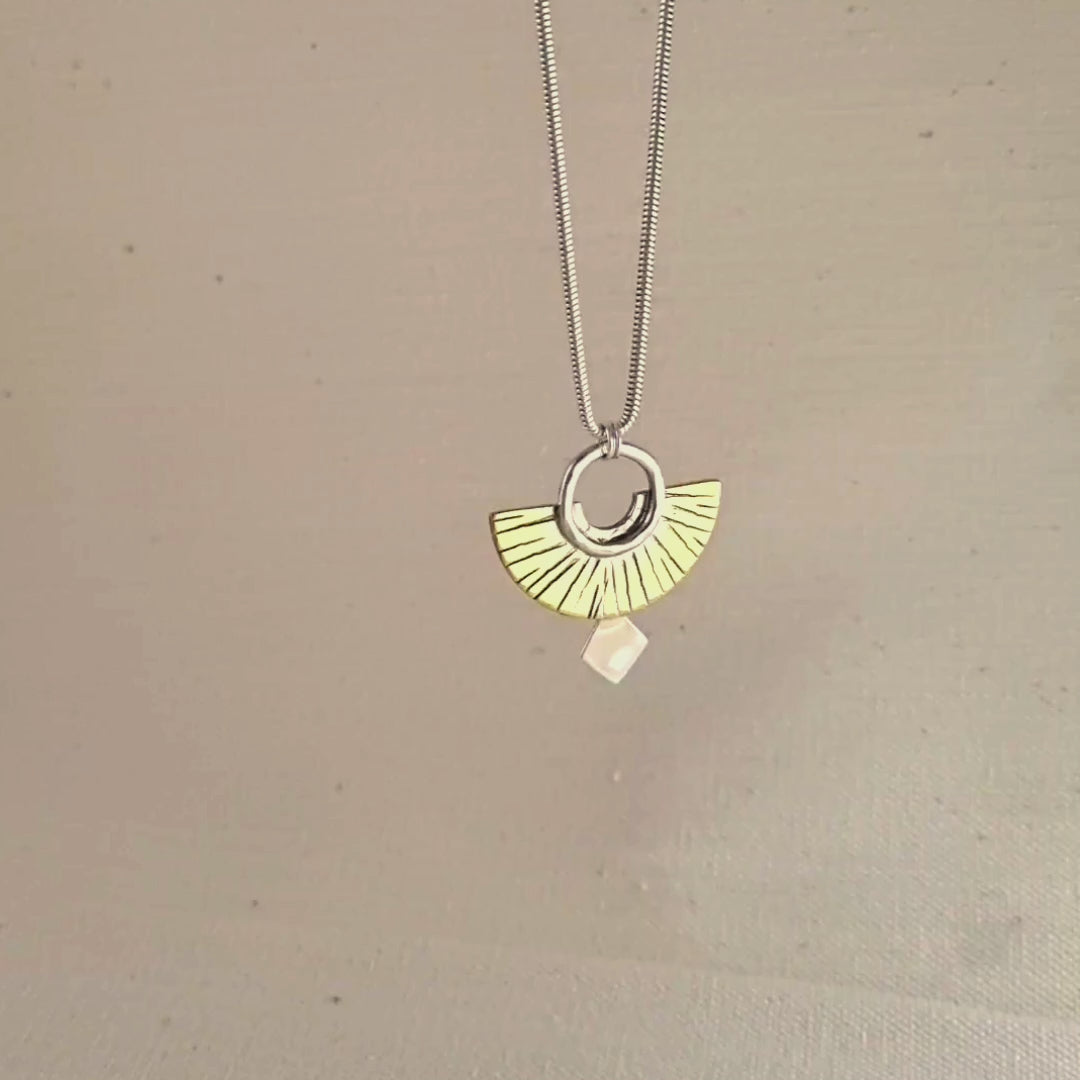 A pendant hanging on a chain